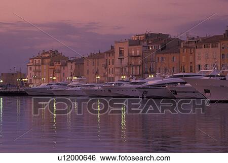 France, St. Tropez, harbor, Cote d' Azur, Provence, Var, Europe, Yachts docked in the harbor of Saint Tropez at sunset on the Mediterranean Sea. View Large Photo Image Stock Photograph - France, St. Tropez, harbor, Cote d' Azur, Provence, Var, Europe, Yachts docked in the harbor of Saint Tropez at sunset on the Mediterranean Sea.. Fotosearch