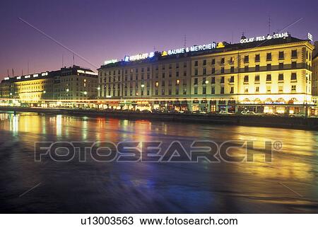 Stock Image -  Geneva, Rhone River, Switzerland, Buildings along the Rhone River in downtown Geneva at night. . Fotosearch