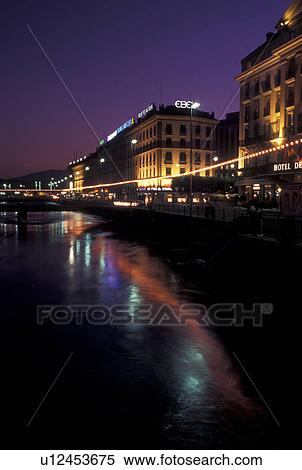 Geneva, Rhone River, Switzerland, Buildings along the Rhone River in downtown Geneva at night. View Large Photo Image Stock Photography - Geneva, Rhone River, Switzerland, Buildings along the Rhone River in downtown Geneva at night. . Fotosearch