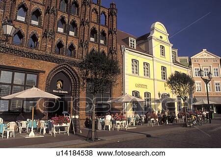 Germany, Wismar, Europe, Mecklenburg-Pomerania, Outdoor cafTs and gabled buildings at Markt in downtown Wismar View Large Photo Image Stock Photo - Germany, Wismar, Europe, Mecklenburg-Pomerania, Outdoor cafTs and gabled buildings at Markt in downtown Wismar. Fotosearch