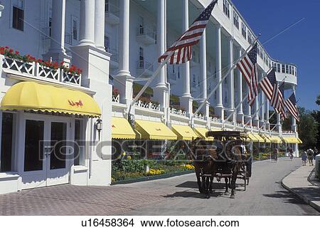 Grand Hotel, carriage tours, Mackinac Island, MI, Lake Huron, Michigan, Carriage ride in front of the Historic Grand Hotel on Mackinac Island. View Large Photo Image Picture - Grand Hotel, carriage tours, Mackinac Island, MI, Lake Huron, Michigan, Carriage ride in front of the Historic Grand Hotel on Mackinac Island.. Fotosearch