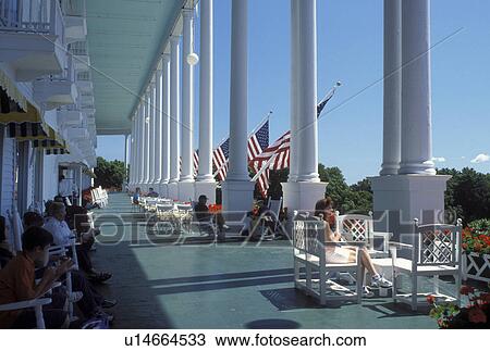 Grand Hotel, Mackinac Island, MI, Lake Huron, Michigan, Hotel guests sitting on the veranda of Historic Grand Hotel on Mackinac Island. View Large Photo Image Stock Image - Grand Hotel, Mackinac Island, MI, Lake Huron, Michigan, Hotel guests sitting on the veranda of Historic Grand Hotel on Mackinac Island.. Fotosearch