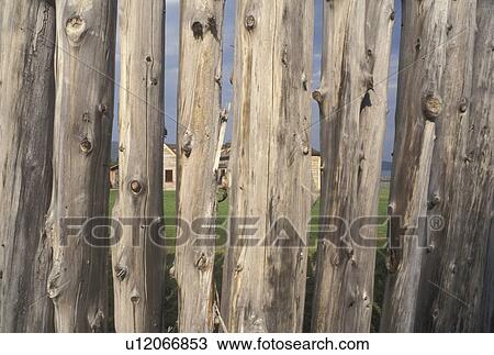 Stock Image -  Grand Portage, Lake Superior, North Shore Drive, MN, Minnesota, Looking through the wooden fence at Grand Portage National Monument in Grand Portage.. Fotosearch