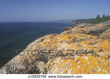 Stock Photo -  Grand Portage, Lake Superior, North Shore Drive, MN, Minnesota, Scenic rocky shoreline along the north shore of Lake Superior in Grand Portage.. Fotosearch