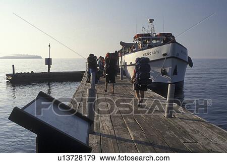 Stock Photo -  Grand Portage, Lake Superior, North Shore Drive, MN, Minnesota, Loading passengers on the Isle Royale Ferry at the dock on the North Shore of Lake Superior in Grand Portage.. Fotosearch