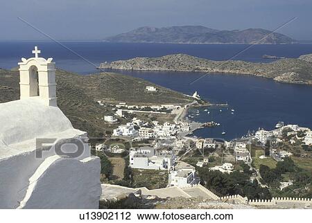 Greece, Ios, Greek Islands, Cyclades, Ormos, Europe, Scenic view of Ormos harbor from a whitewashed church in Hora on Ios Island on the Aegean Sea. View Large Photo Image Stock Image - Greece, Ios, Greek Islands, Cyclades, Ormos, Europe, Scenic view of Ormos harbor from a whitewashed church in Hora on Ios Island on the Aegean Sea.. Fotosearch