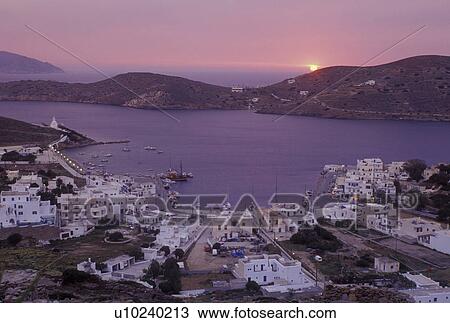 Greece, Ios, Greek Islands, Ormos, Cyclades, Europe, Sunset over Ormos harbor from Hora on Ios Island on the Aegean Sea. View Large Photo Image Stock Image - Greece, Ios, Greek Islands, Ormos, Cyclades, Europe, Sunset over Ormos harbor from Hora on Ios Island on the Aegean Sea.. Fotosearch