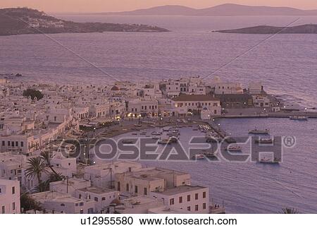 Greece, Mykonos, Cyclades, Greek Islands, Europe, Scenic view of Mykonos Harbor in the evening on the Aegean Sea. View Large Photo Image Stock Image - Greece, Mykonos, Cyclades, Greek Islands, Europe, Scenic view of Mykonos Harbor in the evening on the Aegean Sea.. Fotosearch