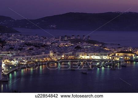 Greece, Mykonos, Greek Islands, Cyclades, Europe, Scenic view of Mykonos Harbor in the evening on the Aegean Sea. View Large Photo Image Stock Image - Greece, Mykonos, Greek Islands, Cyclades, Europe, Scenic view of Mykonos Harbor in the evening on the Aegean Sea.. Fotosearch