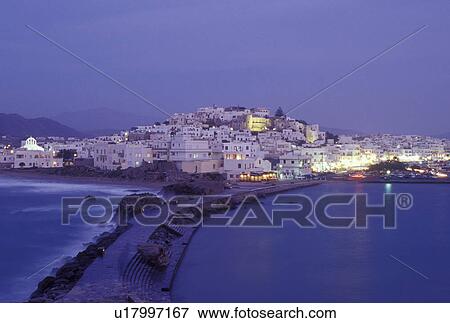 Stock Photo -  Greece, Naxos, Greek Islands, Cyclades, Europe, Scenic view of Hora Naxos and the causeway in the evening from the islet of Palatia on Naxos Island on the Aegean Sea.. Fotosearch