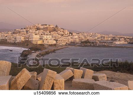 Greece, Naxos, Greek Islands, Cyclades, Europe, Scenic view of Hora Naxos and the causeway from the islet of Palatia and the Temple of Apollo on Naxos Island on the Aegean Sea. View Large Photo Image Stock Photograph - Greece, Naxos, Greek Islands, Cyclades, Europe, Scenic view of Hora Naxos and the causeway from the islet of Palatia and the Temple of Apollo on Naxos Island on the Aegean Sea.. Fotosearch