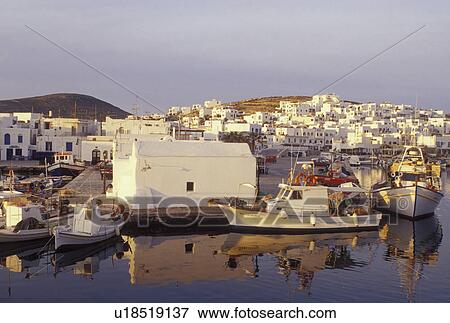 Stock Photo -  Greece, Paros, Greek Islands, Naoussa, Cyclades, Europe, Fishing boats docked in Naoussa Harbor in the early morning on Paros Island on the Aegean Sea.. Fotosearch