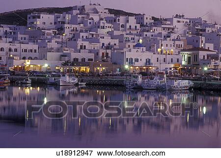 Stock Photo -  Greece, Paros, Greek Islands, Naoussa, Cyclades, Europe, Fishing boats docked in Naoussa Harbor in the evening on Paros Island on the Aegean Sea.. Fotosearch