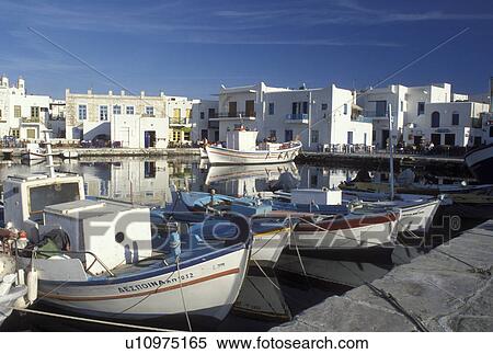 Stock Photography -  Greece, Paros, Greek Islands, Naoussa, Cyclades, Europe, Fishing boats docked in Naoussa Harbor on Paros Island on the Aegean Sea.. Fotosearch