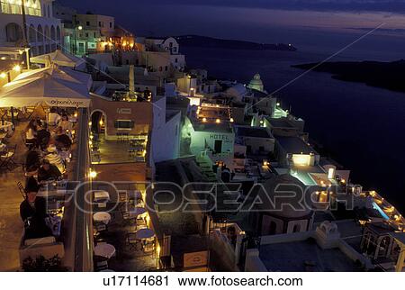Stock Image -  Greece, Santorini, Greek Islands, Fira, Cyclades, Europe, Village of Fira at night on the steep hillside of Santorini Island on the Aegean Sea.. Fotosearch