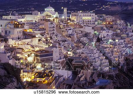 Stock Photograph -  Greece, Santorini, Greek Islands, Fira, Cyclades, Europe, Village of Fira on the steep hillside of Santorini Island in the evening on the Aegean Sea.. Fotosearch