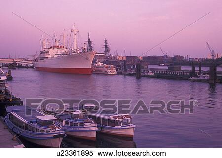 Stock Photography -  Hamburg, port, Germany, Elbe River, North Sea, Europe, Boats docked in Hamburg and St. Pauli's Harbor along the Elbe River. Fotosearch