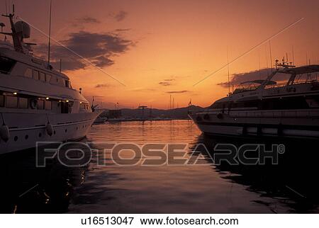 harbor, St. Tropez, France, Cote d' Azur, Provence, Var, Europe, Yachts docked in the harbor in Saint Tropez at sunset on the Mediterranean Sea. View Large Photo Image Stock Photo - harbor, St. Tropez, France, Cote d' Azur, Provence, Var, Europe, Yachts docked in the harbor in Saint Tropez at sunset on the Mediterranean Sea.. Fotosearch