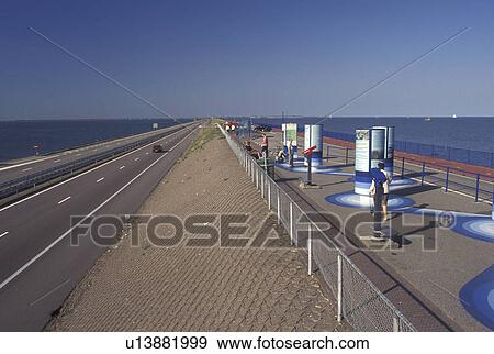 Holland, dike, Netherlands, Europe, North Sea, Noordzee, Nordsee, Waddenzee, Visitor Center along the 30-km long Afsluitdijk or Barrier Dyke along IJsselmeer Lake connects the provinces of (Noord Holland) North Holland and Friesland View Large Photo Image Stock Photo - Holland, dike, Netherlands, Europe, North Sea, Noordzee, Nordsee, Waddenzee, Visitor Center along the 30-km long Afsluitdijk or Barrier Dyke along IJsselmeer Lake connects the provinces of (Noord Holland) North Holland and Friesland. Fotosearch