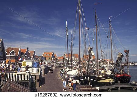 Stock Image -  Holland, Volendam, Netherlands, Noord-Holland, Europe, Waterfront on the harbor on Markermeer in the town of Volendam.. Fotosearch