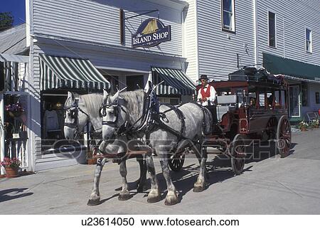 horse drawn carriage, Mackinac Island, MI, Lake Huron, Michigan, Carriage ride down the Main Street downtown Mackinac Island on Lake Huron. View Large Photo Image Stock Image - horse drawn carriage, Mackinac Island, MI, Lake Huron, Michigan, Carriage ride down the Main Street downtown Mackinac Island on Lake Huron.. Fotosearch