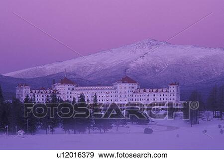 hotel, Bretton Woods, NH, New Hampshire, Scenic view of Historic Mount Washington Hotel & Resort and Mt. Washington in winter in the White Mountains National Forest in the evening. View Large Photo Image Stock Photo - hotel, Bretton Woods, NH, New Hampshire, Scenic view of Historic Mount Washington Hotel & Resort and Mt. Washington in winter in the White Mountains National Forest in the evening.. Fotosearch