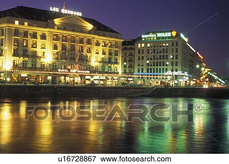 hotel, Rhone River, Geneva, Switzerland, The lights of Hotel des Bergues reflect in the Rhone River in downtown Geneva at night. View Large Photo Image Stock Photo - hotel, Rhone River, Geneva, Switzerland, The lights of Hotel des Bergues reflect in the Rhone River in downtown Geneva at night. . Fotosearch