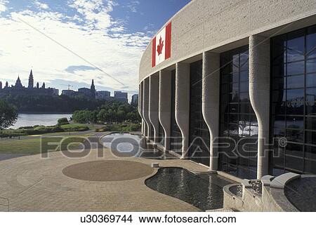 Picture -  Hull, Canada, Quebec, Canadian Museum of Civilization (Musee Canadian des Civilisations) in the city of Hull. Parliament Hill across the Ottawa River in Ottawa, Ontario.. Fotosearch