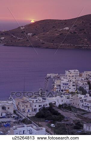 Ios, Greece, Greek Islands, Cyclades, Ormos, Europe, Sunset over Ormos harbor from Hora on Ios Island on the Aegean Sea. View Large Photo Image Stock Image - Ios, Greece, Greek Islands, Cyclades, Ormos, Europe, Sunset over Ormos harbor from Hora on Ios Island on the Aegean Sea.. Fotosearch