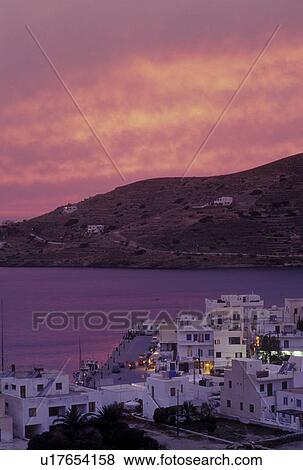 Ios, Greek Islands, Greece, Cyclades, Ormos, Europe, Sunset over Ormos harbor from Hora on Ios Island on the Aegean Sea. View Large Photo Image Stock Photo - Ios, Greek Islands, Greece, Cyclades, Ormos, Europe, Sunset over Ormos harbor from Hora on Ios Island on the Aegean Sea.. Fotosearch