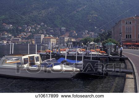 Italy, Como, Lombardia, Lombardy, Lake Como, Southern Alps, Waterfront on Lake Como in the harbor of the village of Como. View Large Photo Image Stock Photo - Italy, Como, Lombardia, Lombardy, Lake Como, Southern Alps, Waterfront on Lake Como in the harbor of the village of Como.. Fotosearch