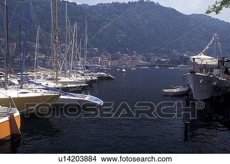Italy, Como, Lombardy, Lombardia, Lake Como, Southern Alps, Boats docked at a marina on Lake Como in the harbor of the village of Como. View Large Photo Image Picture - Italy, Como, Lombardy, Lombardia, Lake Como, Southern Alps, Boats docked at a marina on Lake Como in the harbor of the village of Como.. Fotosearch