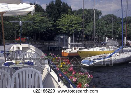 Italy, Lake Como, Como, Lombardia, Lombardy, Southern Alps, Floating restaurant on Lake Como in the harbor of the village of Como. View Large Photo Image Stock Photo - Italy, Lake Como, Como, Lombardia, Lombardy, Southern Alps, Floating restaurant on Lake Como in the harbor of the village of Como.. Fotosearch