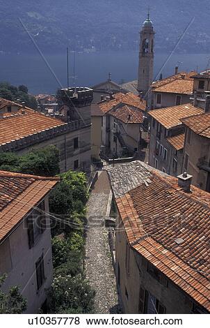 Italy, Lake Como, Moltrasio, Lombardy, Lombardia, Southern Alps, Scenic view of Lake Como from the rooftops of the village of Moltrasio. View Large Photo Image Stock Photo - Italy, Lake Como, Moltrasio, Lombardy, Lombardia, Southern Alps, Scenic view of Lake Como from the rooftops of the village of Moltrasio.. Fotosearch