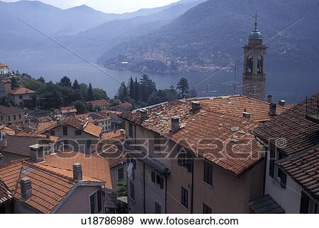 Italy, Moltrasio, Lombardy, Lombardia, Lake Como, Southern Alps, Scenic view of Lake Como from the rooftops of the village of Moltrasio. View Large Photo Image Stock Photo - Italy, Moltrasio, Lombardy, Lombardia, Lake Como, Southern Alps, Scenic view of Lake Como from the rooftops of the village of Moltrasio.. Fotosearch