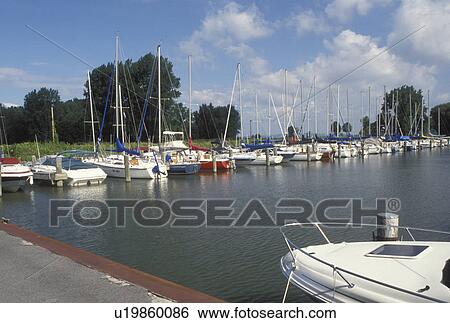 Stock Photograph -  Ithaca, NY, New York, Finger Lakes, Marina at Treman State Marine Parkon Cayuga Lake in Ithaca in the Finger Lakes Region.. Fotosearch