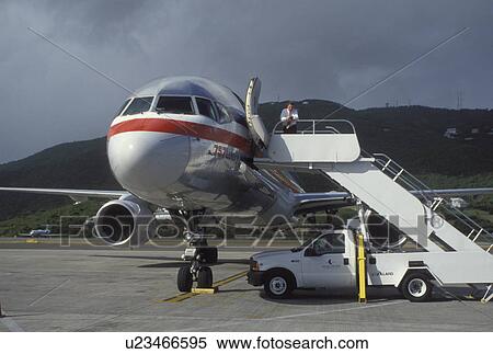 Stock Photography -  jet, Caribbean, St. Thomas, U. S. Virgin Islands, USVI, American Airlines Jet parked at the gate at Cycil E. King Airport terminal on Saint Thomas Island.. Fotosearch