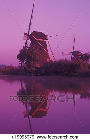Kinderdijk, windmill, canal, Netherlands, Holland, Zuid-Holland, Europe, Mills of Kinderdijk, Working windmills along a canal in the early morning in Kinderdijk. View Large Photo Image Stock Photo - Kinderdijk, windmill, canal, Netherlands, Holland, Zuid-Holland, Europe, Mills of Kinderdijk, Working windmills along a canal in the early morning in Kinderdijk. . Fotosearch