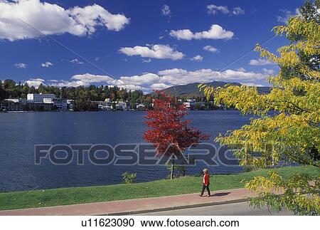 Lake Placid, NY, New York, The Adirondacks, Recreation path along Mirror Lake with a scenic view of the resort town of Lake Placid in the autumn. View Large Photo Image Stock Image - Lake Placid, NY, New York, The Adirondacks, Recreation path along Mirror Lake with a scenic view of the resort town of Lake Placid in the autumn.. Fotosearch