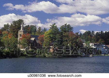 Lake Placid, NY, New York, The Adirondacks, Scenic view of the resort town of Lake Placid along Mirror Lake in the autumn. View Large Photo Image Stock Photograph - Lake Placid, NY, New York, The Adirondacks, Scenic view of the resort town of Lake Placid along Mirror Lake in the autumn.. Fotosearch