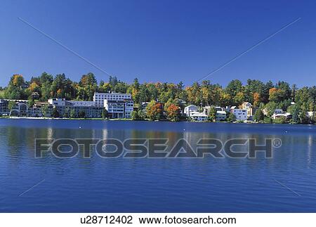 Lake Placid, NY, The Adirondacks, New York, Scenic view of the resort town of Lake Placid along Mirror Lake in the autumn. View Large Photo Image Stock Image - Lake Placid, NY, The Adirondacks, New York, Scenic view of the resort town of Lake Placid along Mirror Lake in the autumn.. Fotosearch