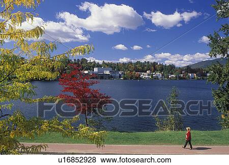Lake Placid, The Adirondacks, NY, New York, Recreation path along Mirror Lake with a scenic view of the resort town of Lake Placid in the autumn. View Large Photo Image Stock Photo - Lake Placid, The Adirondacks, NY, New York, Recreation path along Mirror Lake with a scenic view of the resort town of Lake Placid in the autumn.. Fotosearch