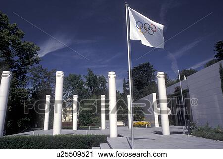 Stock Image -  Lausanne, Switzerland, Ouchy, Olympic Museum, Vaud, Olympic colums and flag at Musee Olympique in Lausanne. Fotosearch