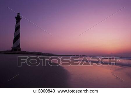lighthouse, Cape Hatteras National Seashore, Outer Banks, North Carolina, NC, Cape Hatteras Lighthouse at sunrise on Cape Hatteras Nat'l Seashore on the Outer Banks. View Large Photo Image Stock Image - lighthouse, Cape Hatteras National Seashore, Outer Banks, North Carolina, NC, Cape Hatteras Lighthouse at sunrise on Cape Hatteras Nat'l Seashore on the Outer Banks.. Fotosearch