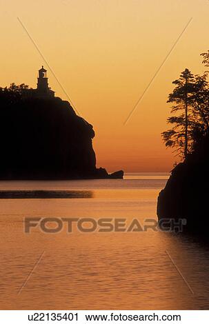 lighthouse, sunrise, Lake Superior, North Shore Drive, Two Harbors, MN, Minnesota, Split Rock Lighthouse situated on a high cliff on the north shore of Lake Superior at Split Rock Lighthouse State Park in Two Harbors at sunrise. View Large Photo Image Stock Image - lighthouse, sunrise, Lake Superior, North Shore Drive, Two Harbors, MN, Minnesota, Split Rock Lighthouse situated on a high cliff on the north shore of Lake Superior at Split Rock Lighthouse State Park in Two Harbors at sunrise.. Fotosearch