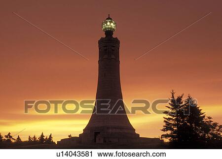 Stock Image -  lighthouse, tower, Mt, Greylock, North Adams, MA, Massachusetts, War Veterans Memorial Tower at sunrise on the summit of Mount Greylock at Mount Greylock State Reservation.. Fotosearch