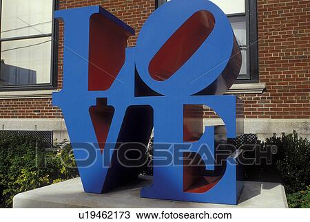 Stock Image -  LOVE, Rockland, ME, Maine, Blue LOVE sculpture displayed outside the Farnsworth Art Museum and the Wyeth Center in the autumn.. Fotosearch