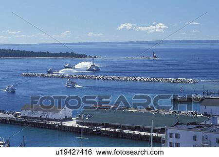 Mackinac Island, MI, Lake Huron, Michigan, Scenic view of the harbor from Mackinac Island on Lake Huron. View Large Photo Image Stock Photograph - Mackinac Island, MI, Lake Huron, Michigan, Scenic view of the harbor from Mackinac Island on Lake Huron.. Fotosearch