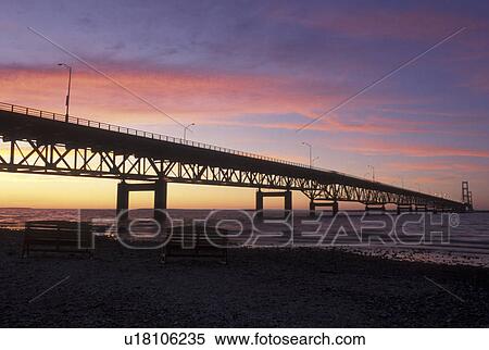 Stock Photography -  Mackinaw City, bridge, MI, Michigan, Upper Peninsula, View of Mackinac Bridge, a suspension span bridge, at sunset crosses the Straits of Mackinaw in Mackinaw City connecting the Lower Peninsula with the Upper Peninsula of Michigan.. Fotosearch