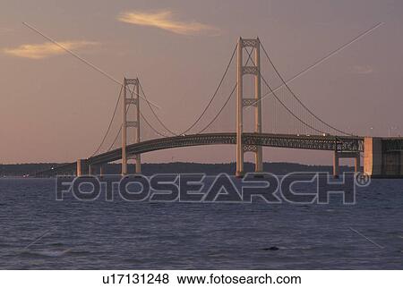 Mackinaw City, MI, Michigan, Upper Peninsula, Mackinac Bridge, a suspension span bridge, crosses the Straits of Mackinaw in Mackinaw City connecting the Lower Peninsula with the Upper Peninsula of Michigan. View Large Photo Image Stock Photo - Mackinaw City, MI, Michigan, Upper Peninsula, Mackinac Bridge, a suspension span bridge, crosses the Straits of Mackinaw in Mackinaw City connecting the Lower Peninsula with the Upper Peninsula of Michigan.. Fotosearch